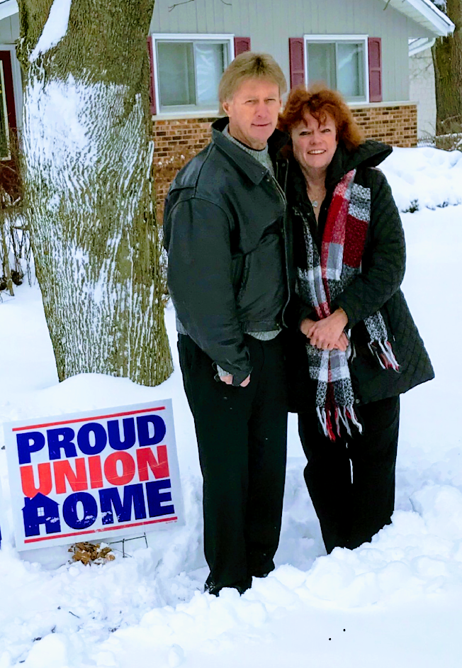 ADC President Jim Allen and his wife Lin display their proud union home sign.
